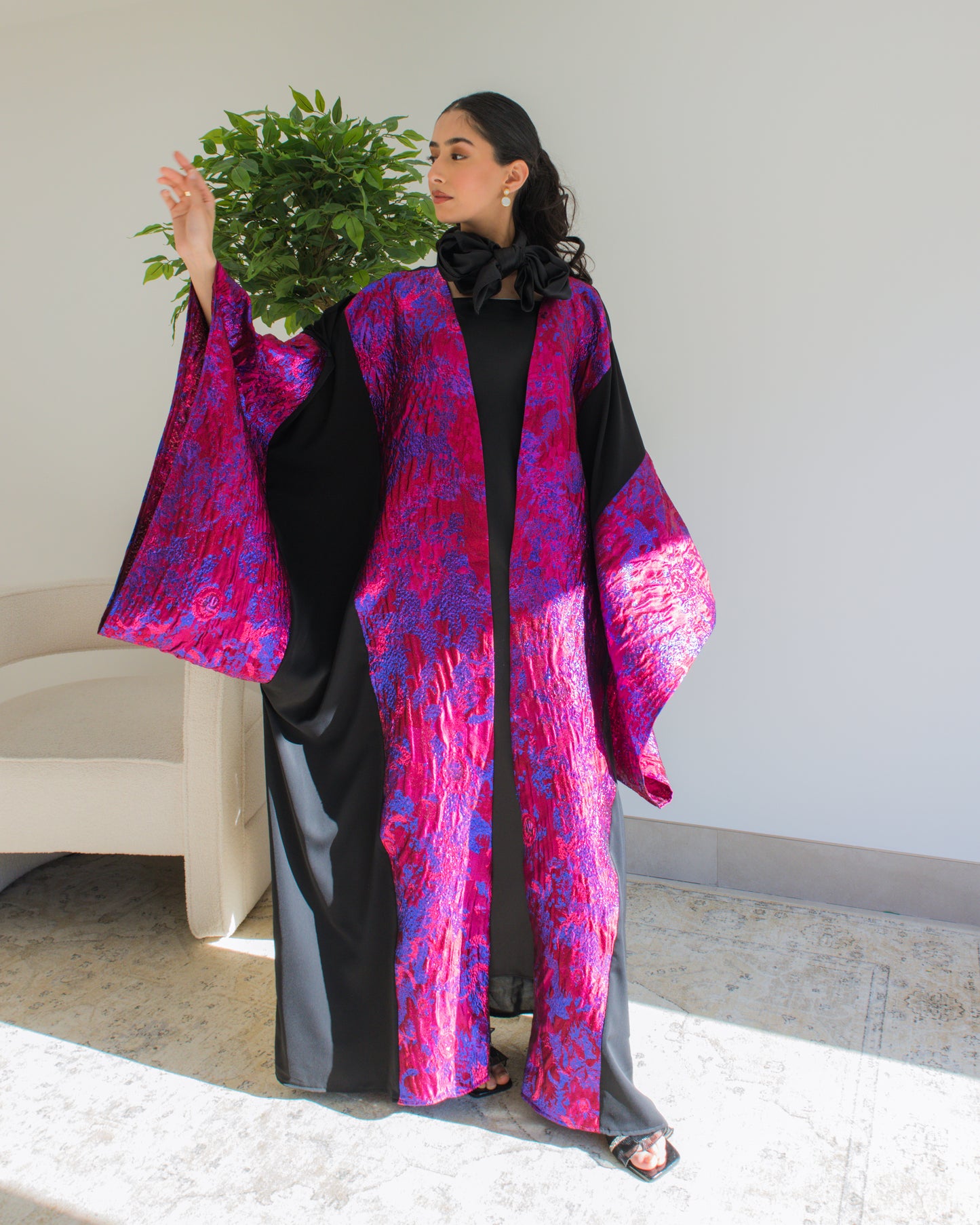 Hot pink and black brocade abaya with wide sleeves
Modest abaya