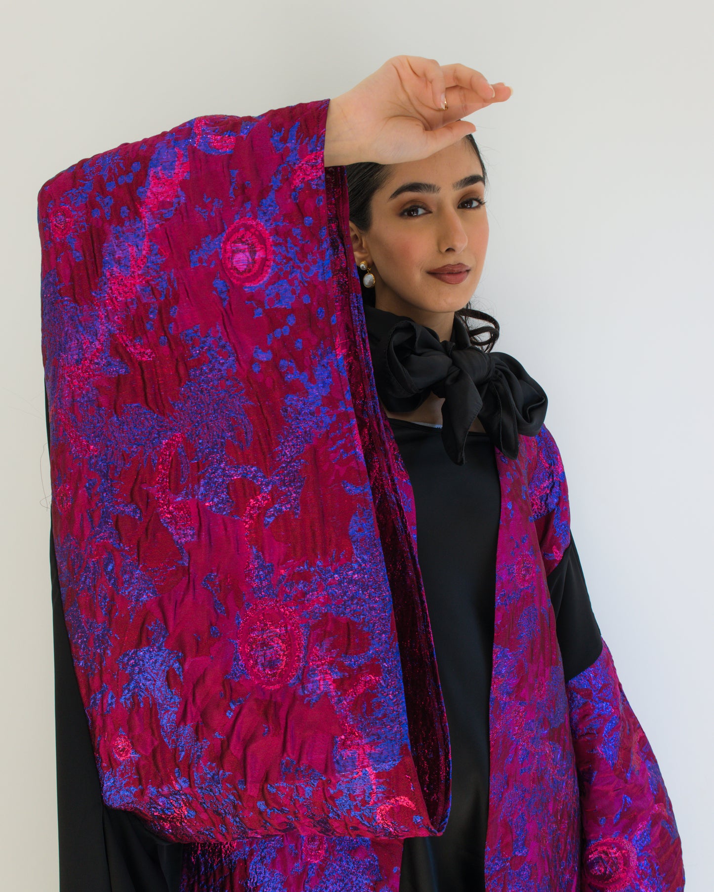 Hot pink and black brocade abaya with wide sleeves
Modest abaya