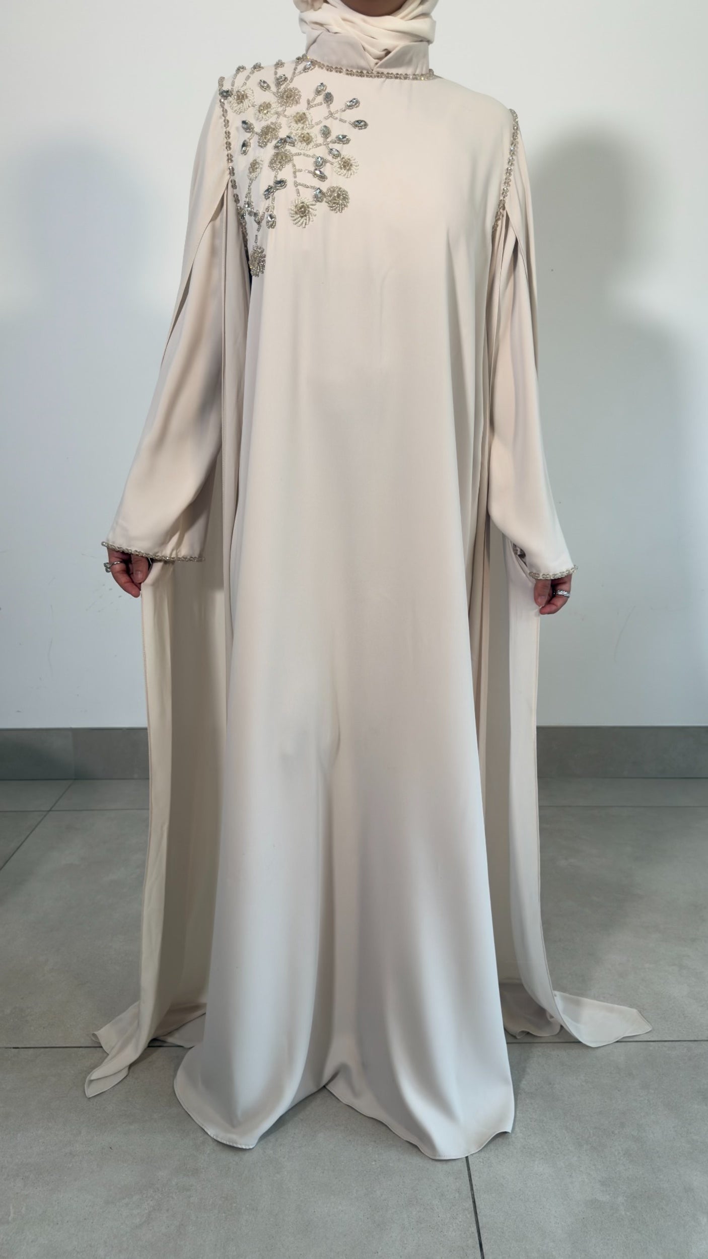 Beige shoulder embellished cape dress