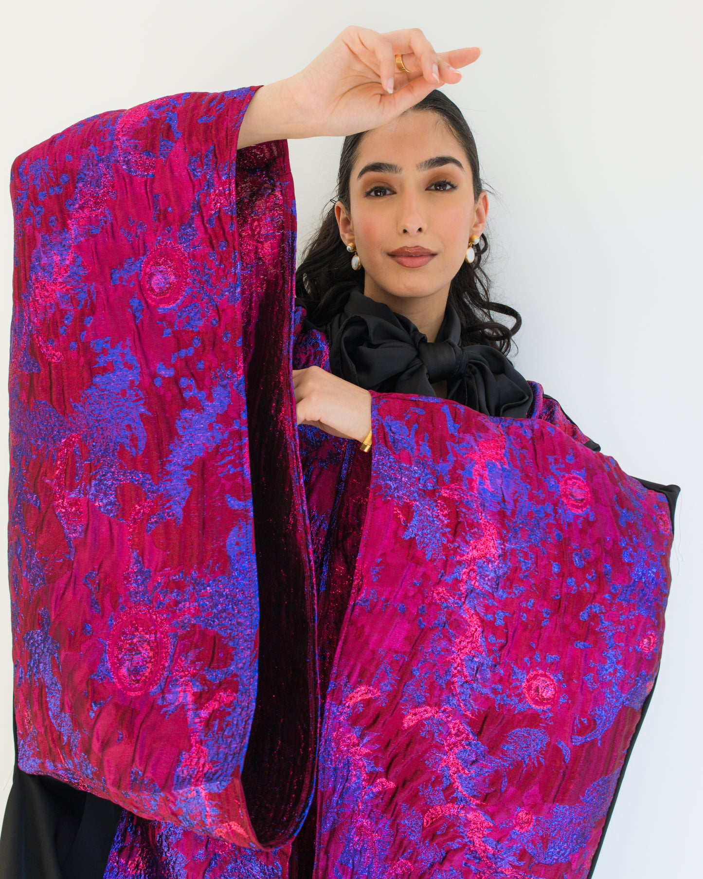 Hot pink and black brocade abaya with wide sleeves
Modest abaya