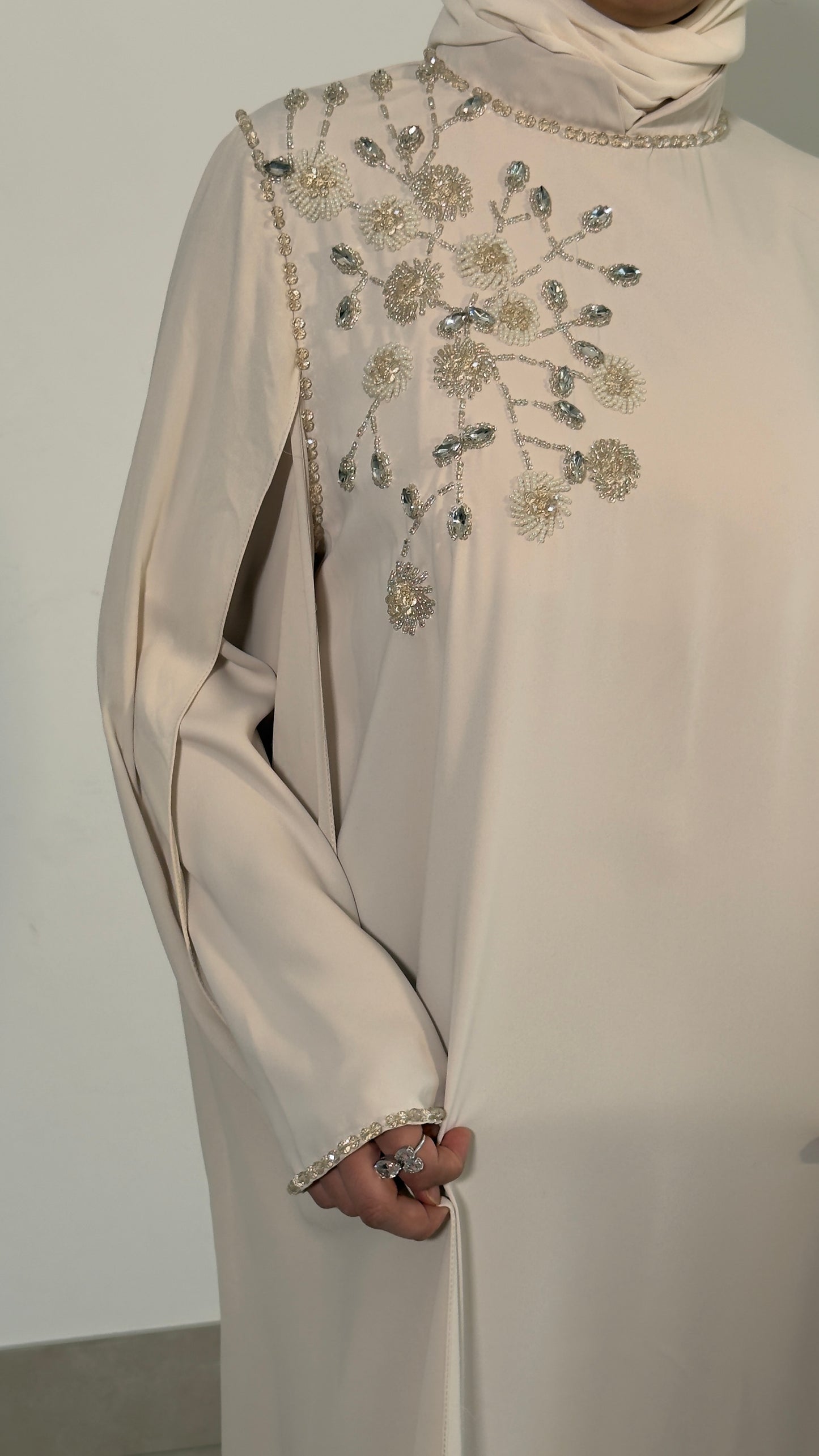 Beige shoulder embellished cape dress